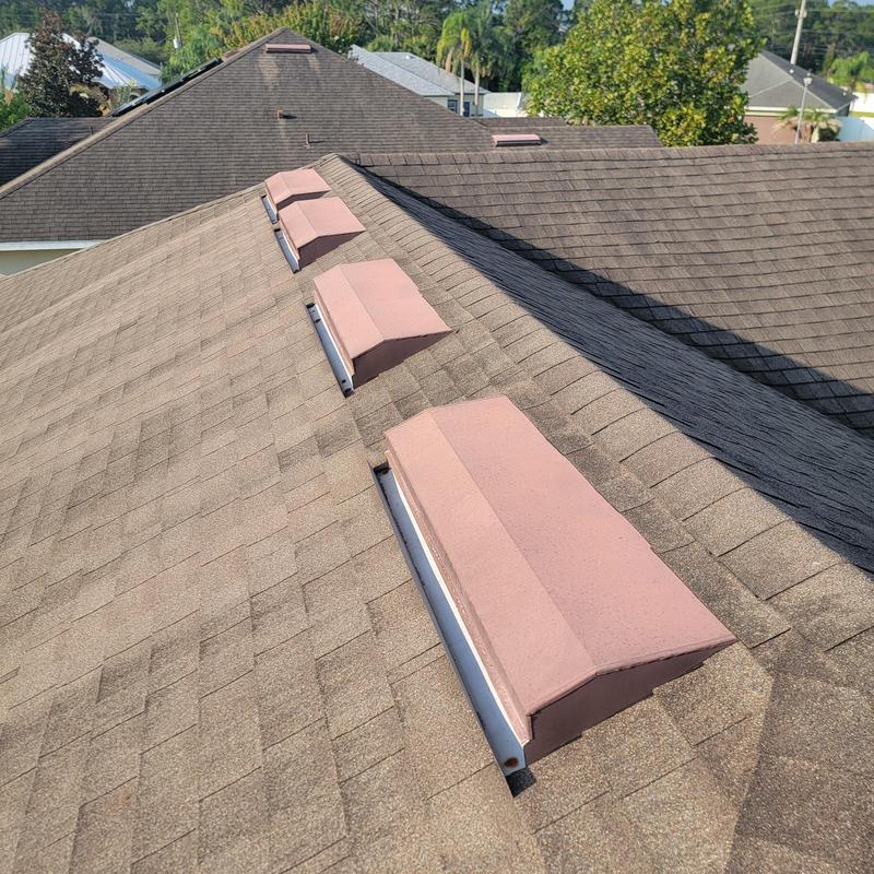 Roof ridge vents showing weathered shingles Roof ridge vents showing weathered shingles