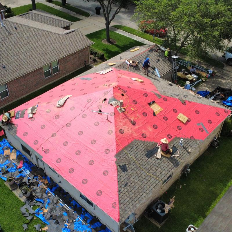 Roofing underlayment installation on residential roof