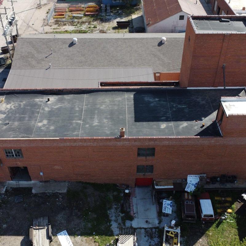Flat commercial roof with membrane covering inspection Flat commercial roof with membrane covering inspection