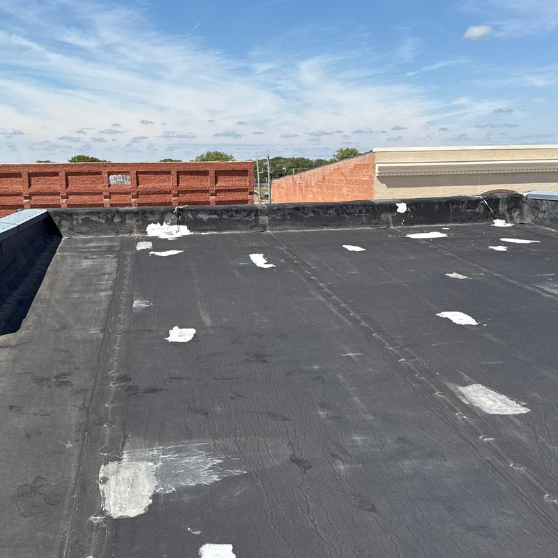 Flat roof membrane with patch repairs in Superior, NE Flat roof membrane with patch repairs in Superior, NE