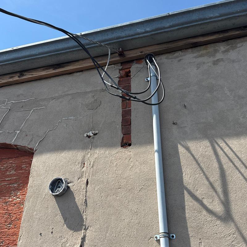 Electrical conduit installation on exterior wall in Superior, NE Electrical conduit installation on exterior wall in Superior, NE