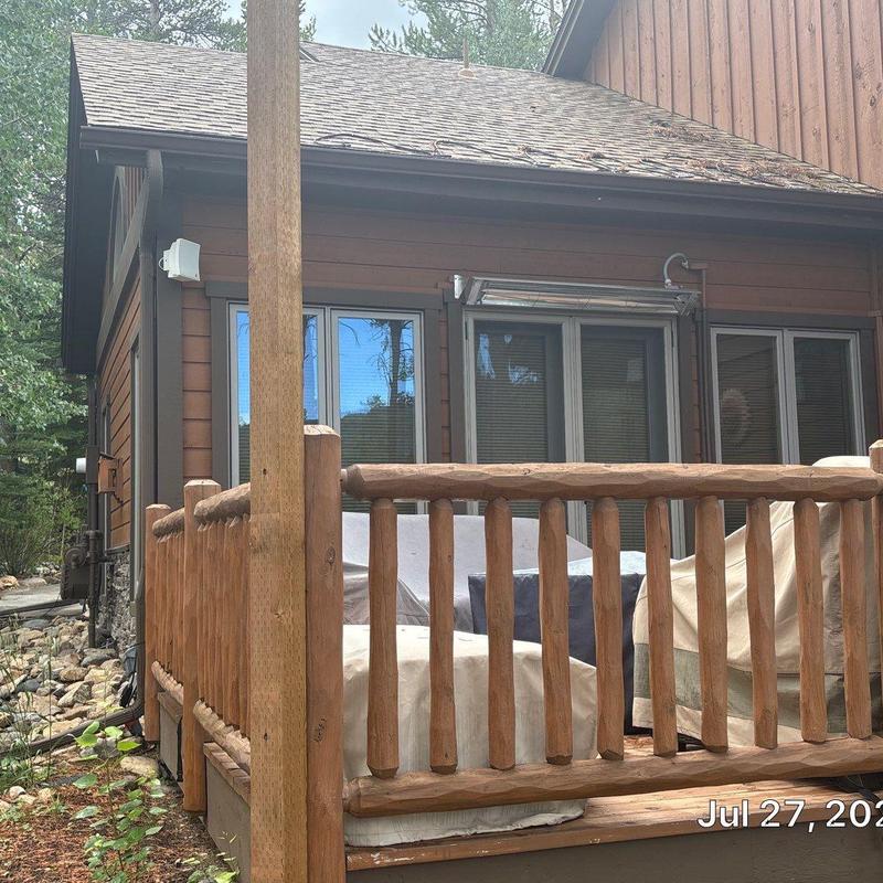 Heat tape on roof edge with wood porch railing