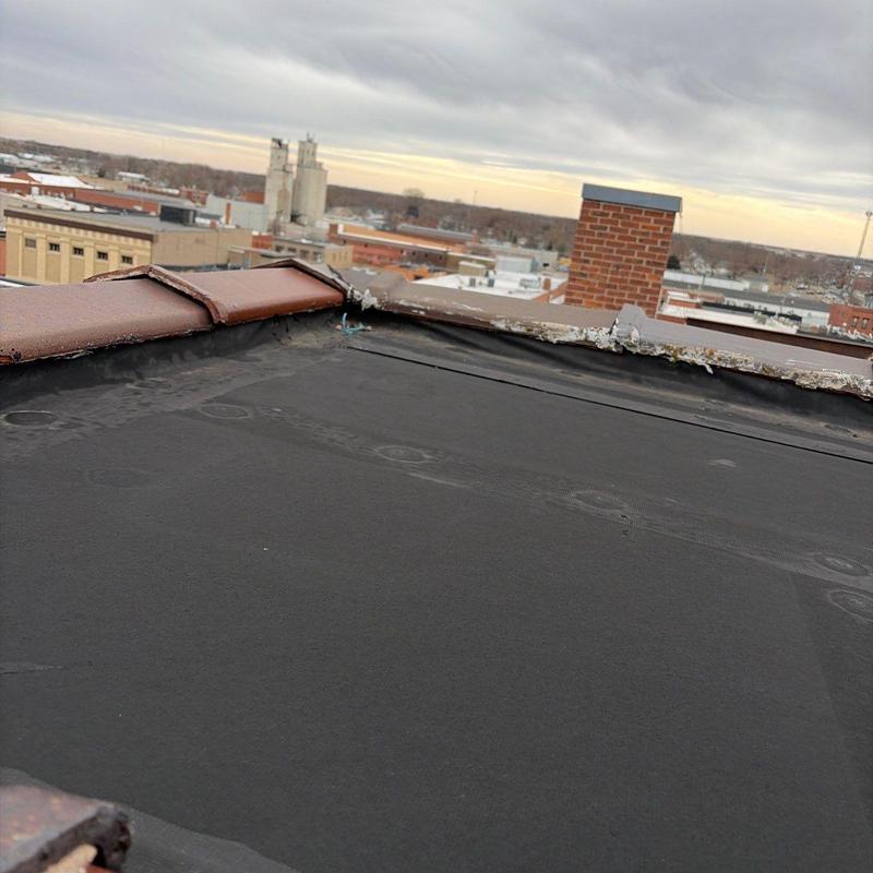 Flat roof membrane with damaged flashing edge Flat roof membrane with damaged flashing edge