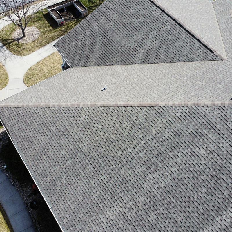 Asphalt shingle roof with ridge vent installation Asphalt shingle roof with ridge vent installation