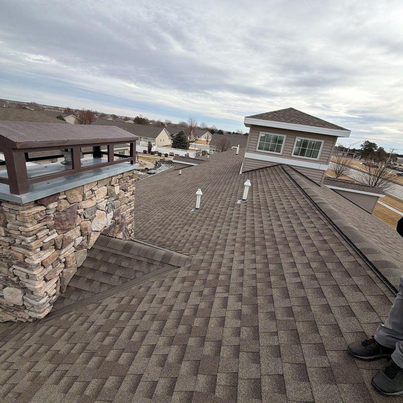 Asphalt shingle roof with chimney and ventilation pipes Asphalt shingle roof with chimney and ventilation pipes