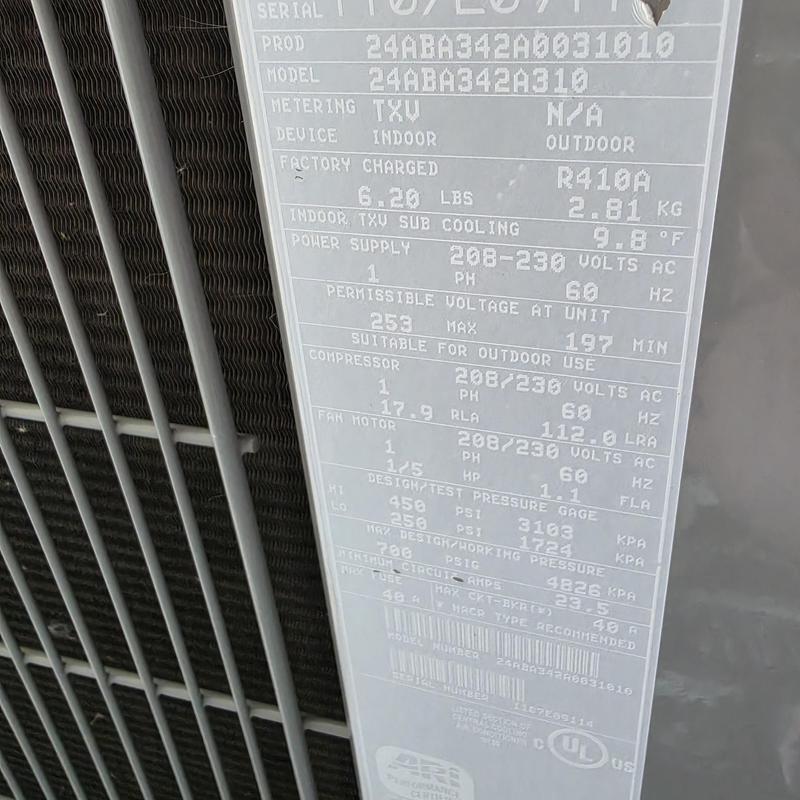 Carrier 24ABA342A310 air conditioner unit label close-up Carrier 24ABA342A310 air conditioner unit label close-up