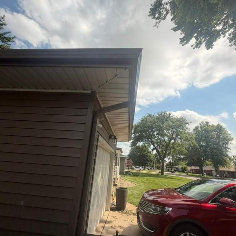 Gutter system and downspout on residential garage Gutter system and downspout on residential garage