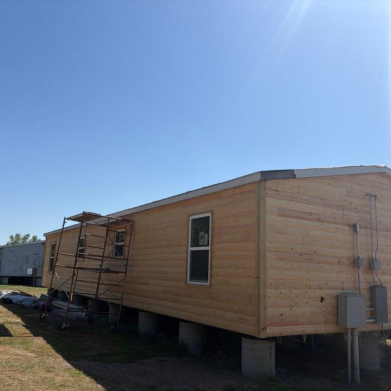 Mobile home exterior siding and scaffolding setup Mobile home exterior siding and scaffolding setup