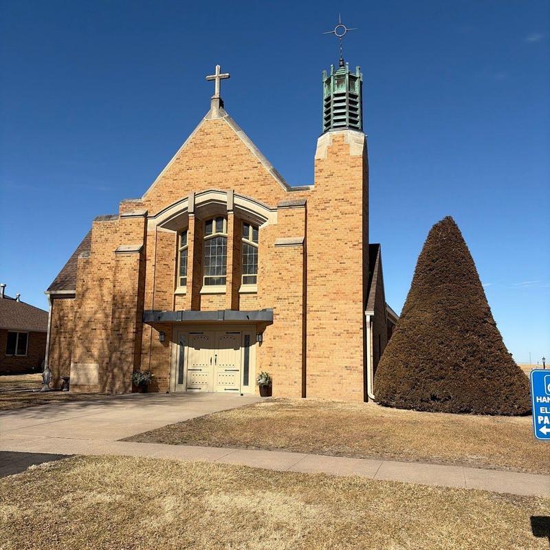 Brick church exterior with steeple and entrance doors Brick church exterior with steeple and entrance doors