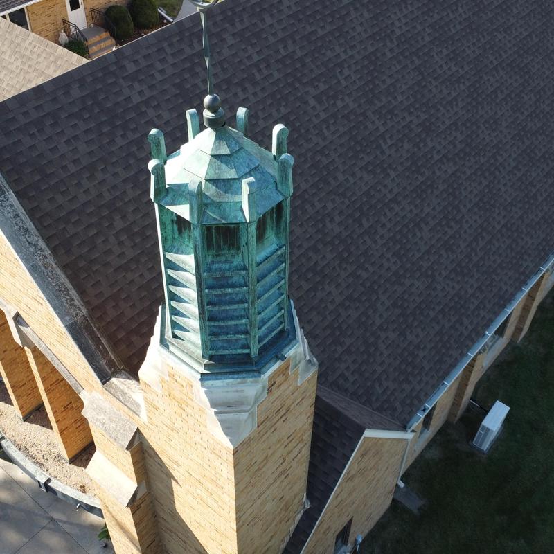 Copper cupola on brick church roof in Roseland Copper cupola on brick church roof in Roseland