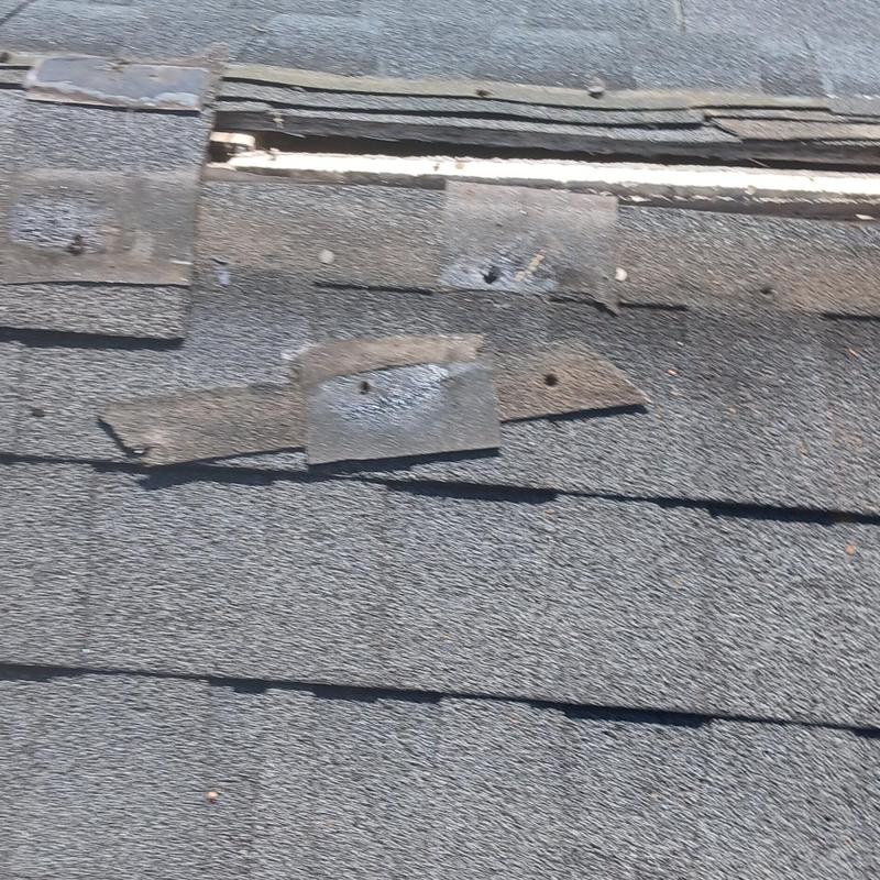 Missing ridge vent section on asphalt shingle roof