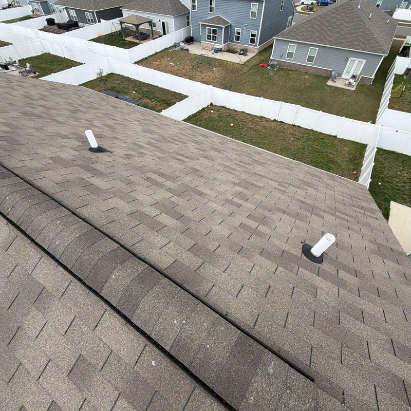 Asphalt shingles roof with hail damage and pipe flashings