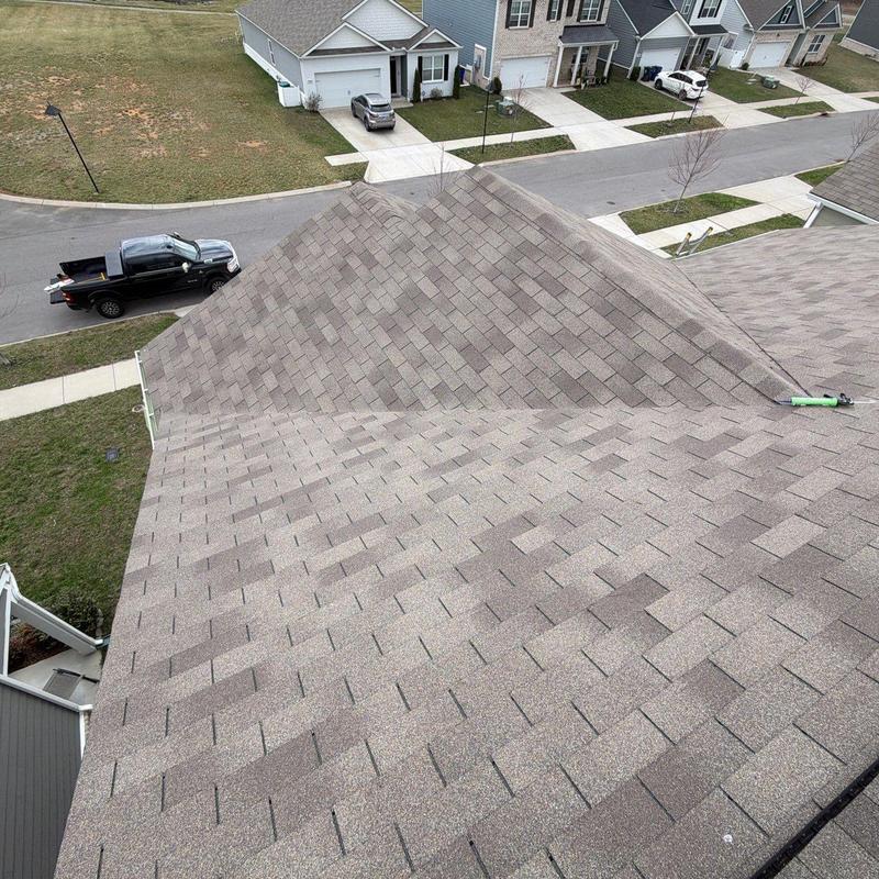 Asphalt shingles with hail damage on roof slope
