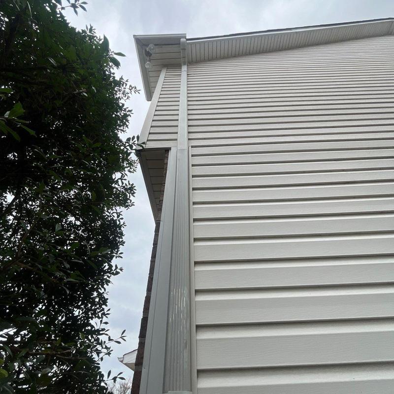 Vinyl siding and gutter system on house exterior