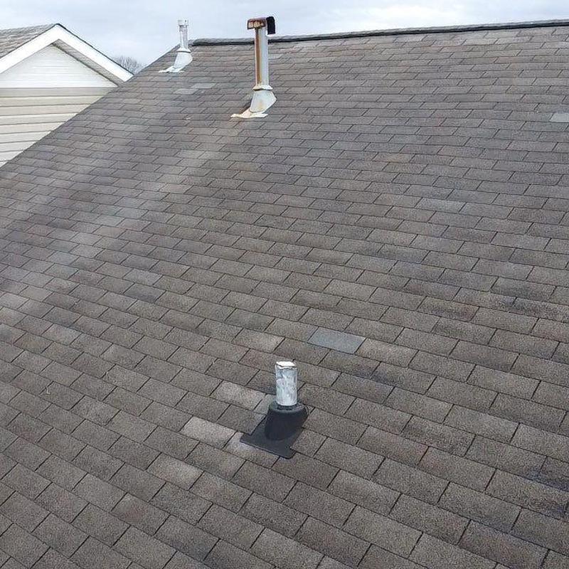 Asphalt shingle roof with vent pipe and flashing