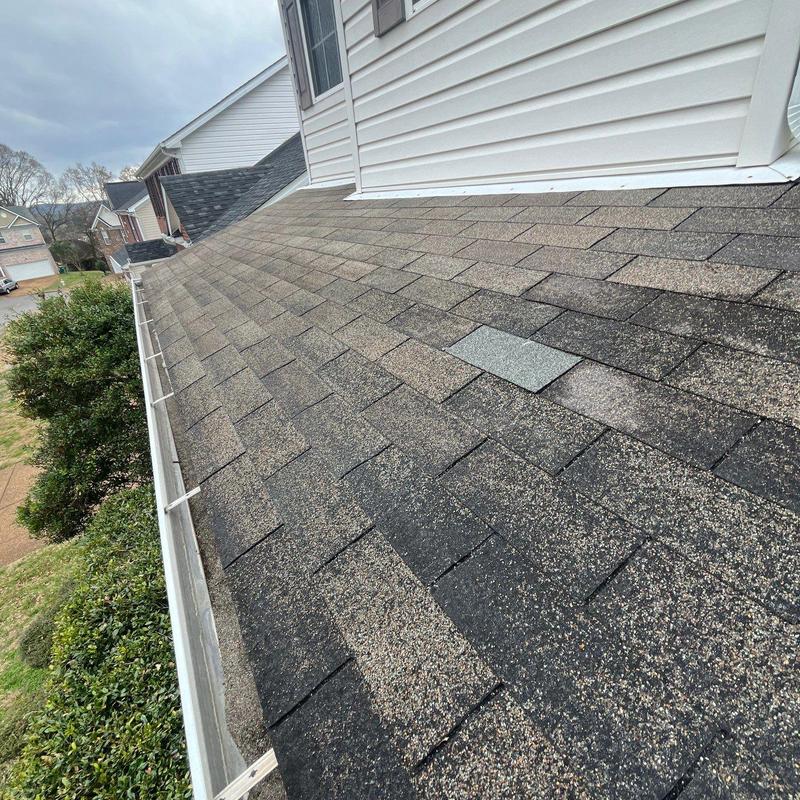 Asphalt shingle roof with hail damage inspection