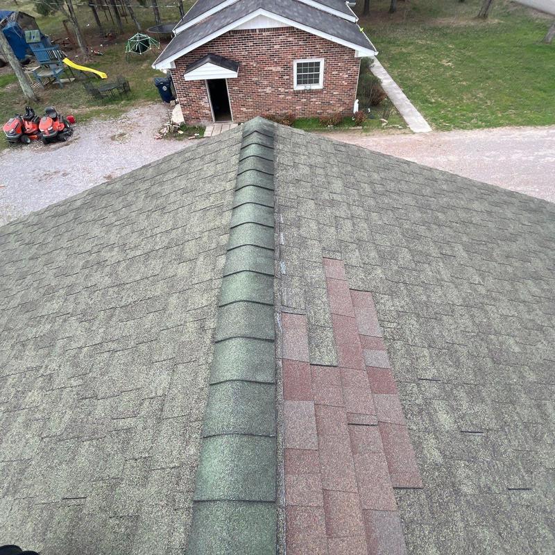 Roof shingles with visible color and wear differences