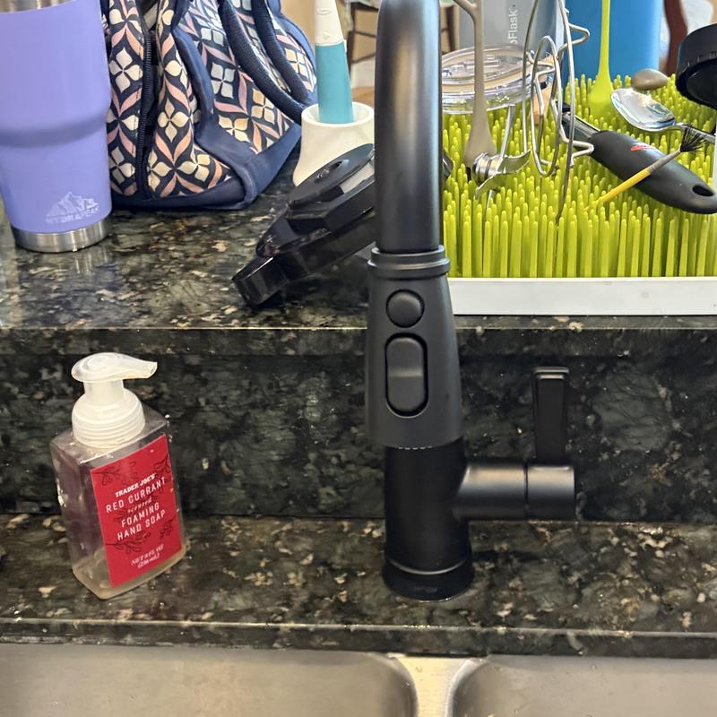 Kitchen sink faucet and handle on granite countertop Kitchen sink faucet and handle on granite countertop