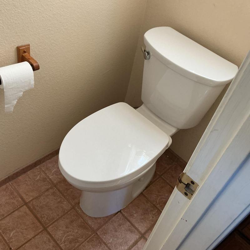 ADA elongated toilet in small bathroom corner ADA elongated toilet in small bathroom corner