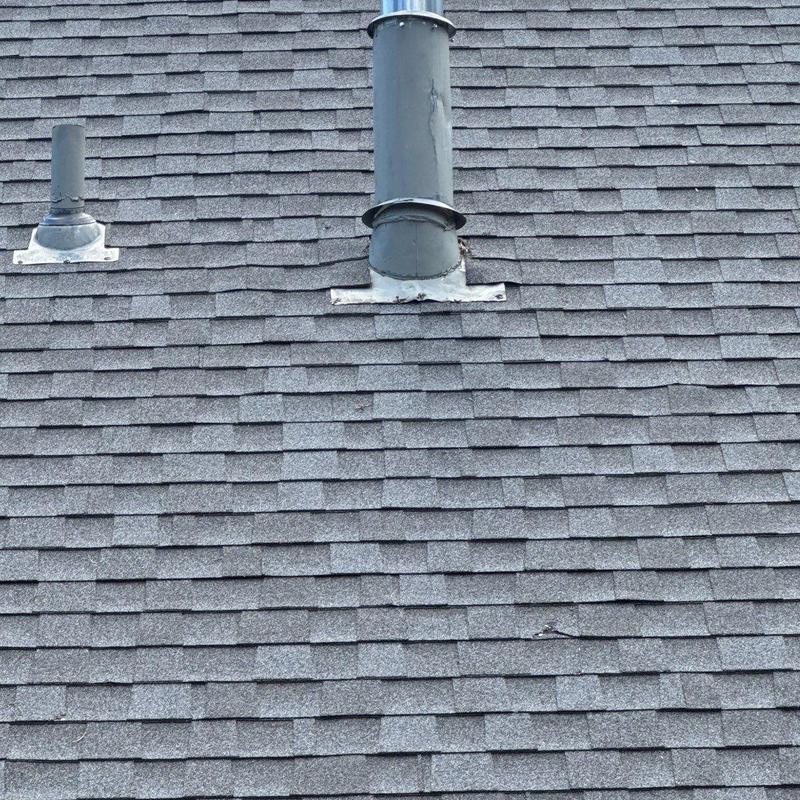 Roof vent pipe flashing on asphalt shingle roof