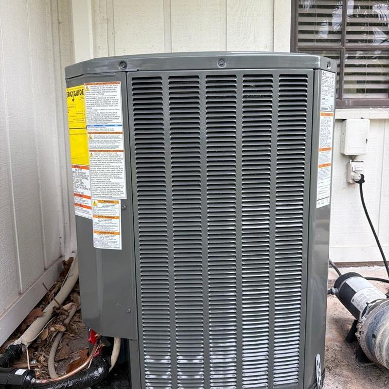 RunTru by Trane condenser HVAC unit installed outdoors RunTru by Trane condenser HVAC unit installed outdoors