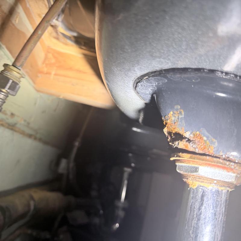 Sink drain pipe with rust and corrosion damage Sink drain pipe with rust and corrosion damage