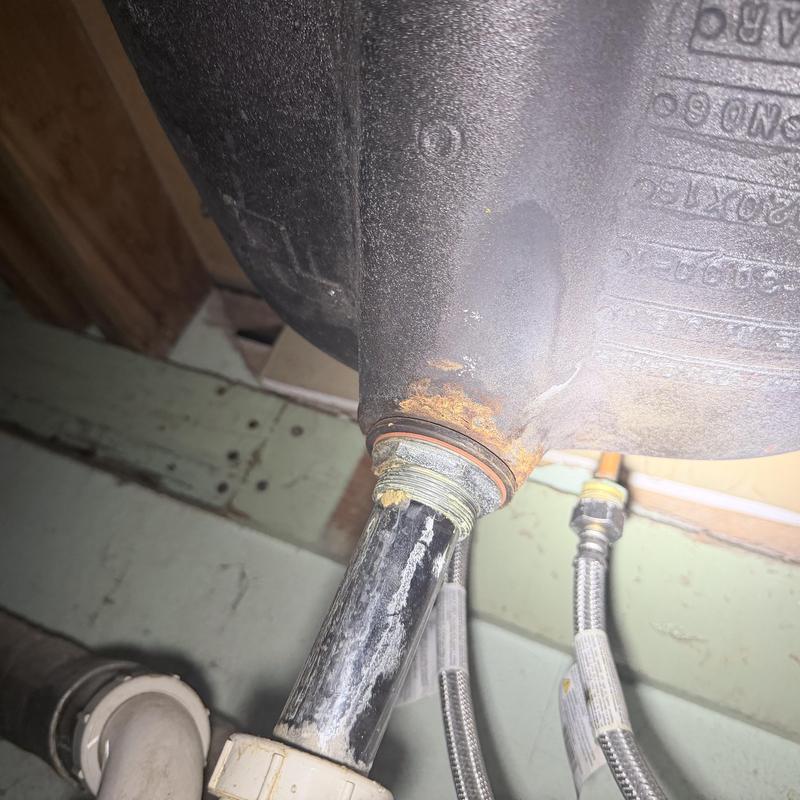 Sink drain pipe with rust and corrosion buildup Sink drain pipe with rust and corrosion buildup