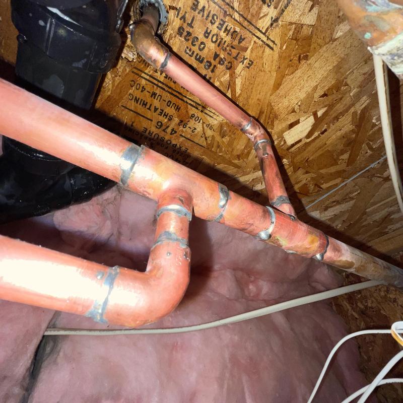 Copper water supply piping with soldered joints in attic Copper water supply piping with soldered joints in attic
