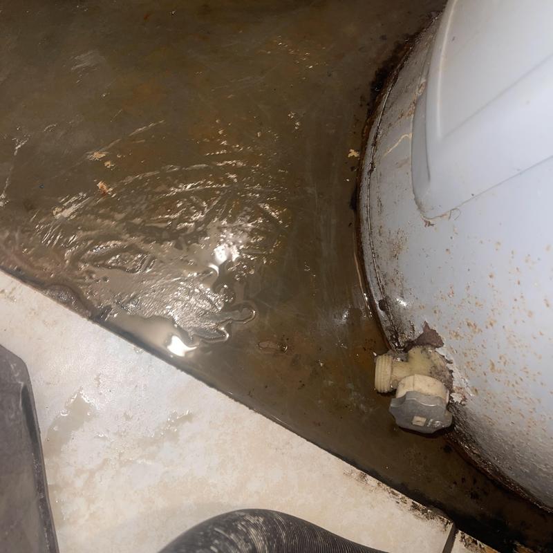 Air handler leaking water near drain valve and floor