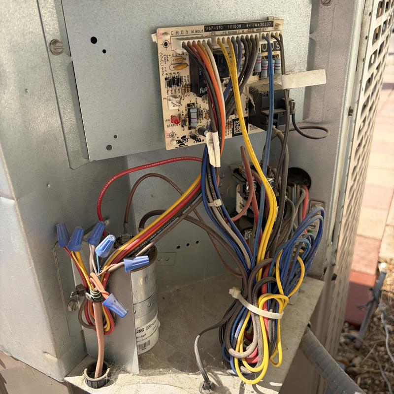 Heat pump control board with wiring connections inside unit