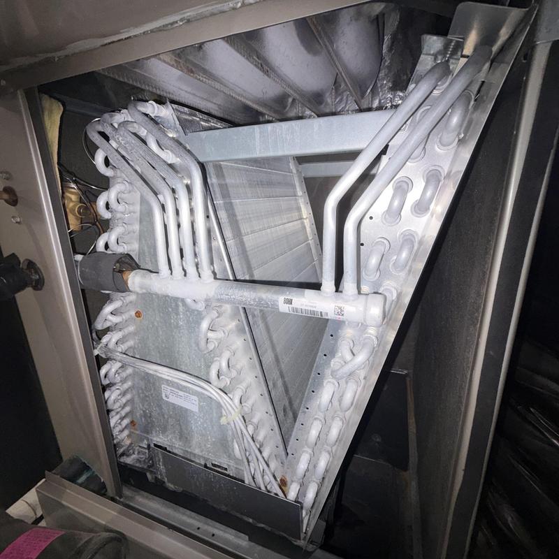 Evaporator coil with frost buildup inside HVAC system