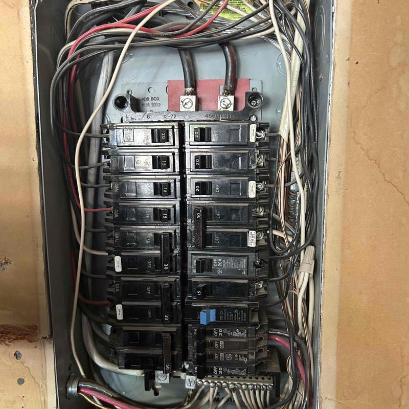 Main service electrical panel with circuit breakers and wiring Main service electrical panel with circuit breakers and wiring