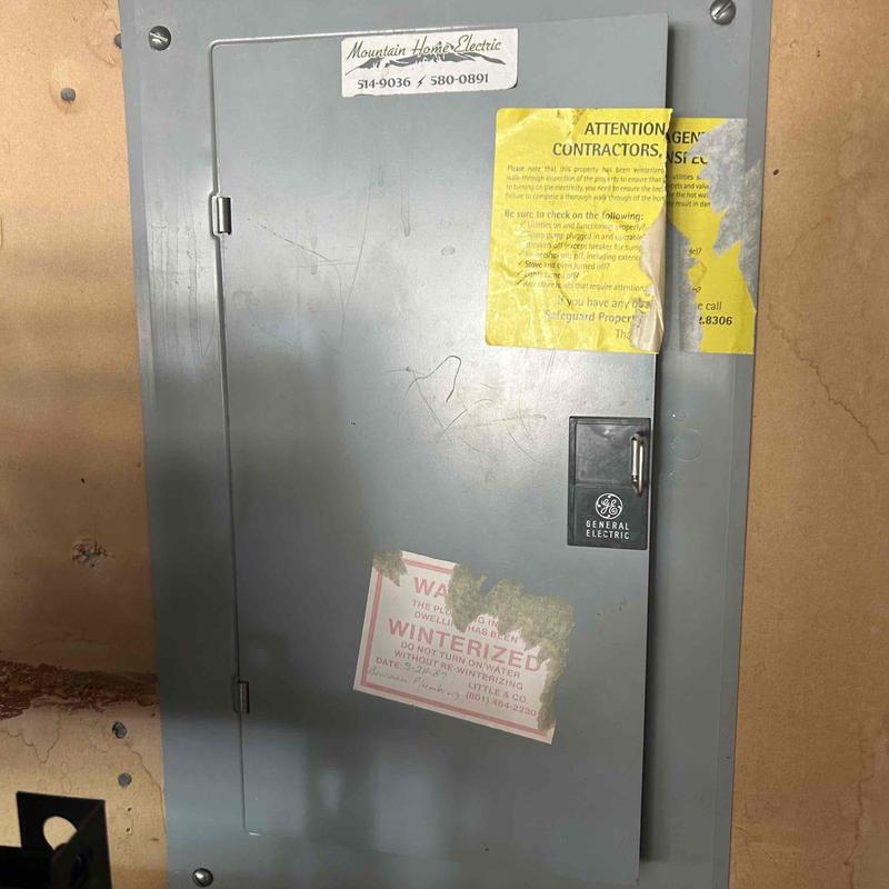 Electrical main service panel with warning labels Electrical main service panel with warning labels
