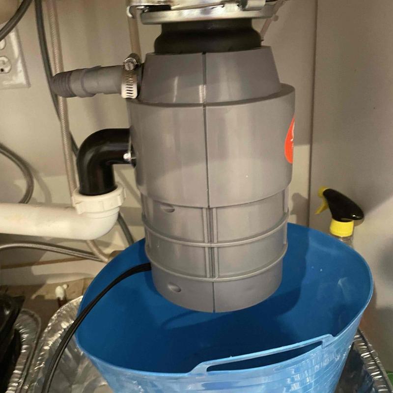 Garbage disposal leaking over bucket under sink plumbing Garbage disposal leaking over bucket under sink plumbing