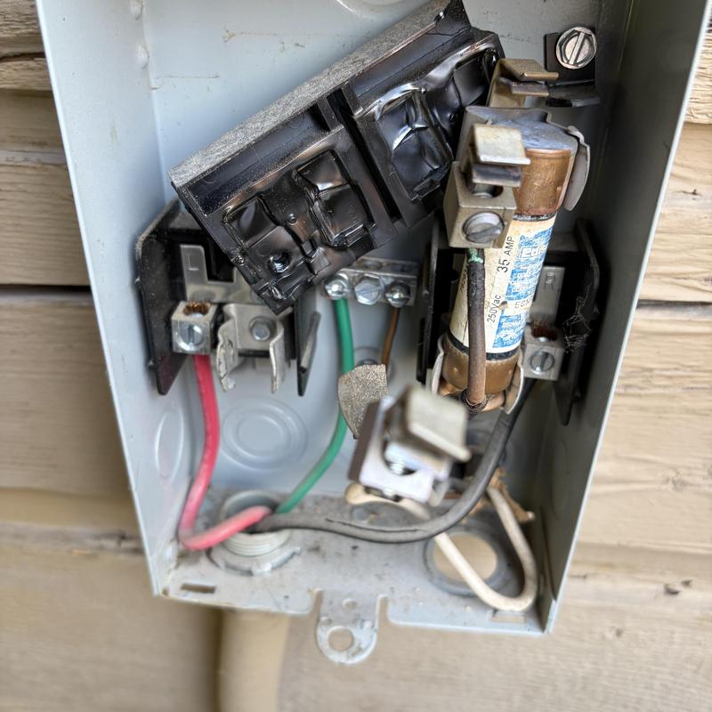 Melted air conditioner outdoor electrical disconnect box Melted air conditioner outdoor electrical disconnect box