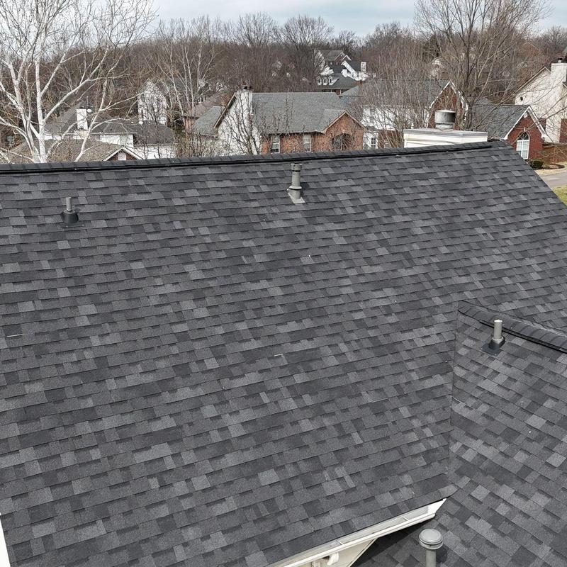 Asphalt shingle roof with ventilation pipes and flashing