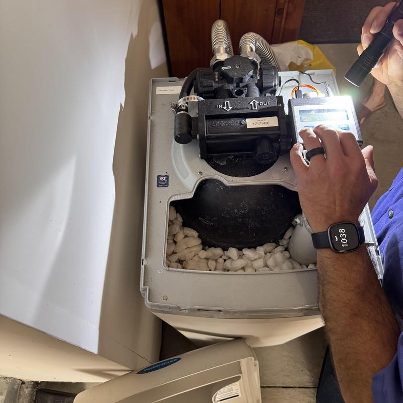 Water softener motor inspection with flashlight Water softener motor inspection with flashlight