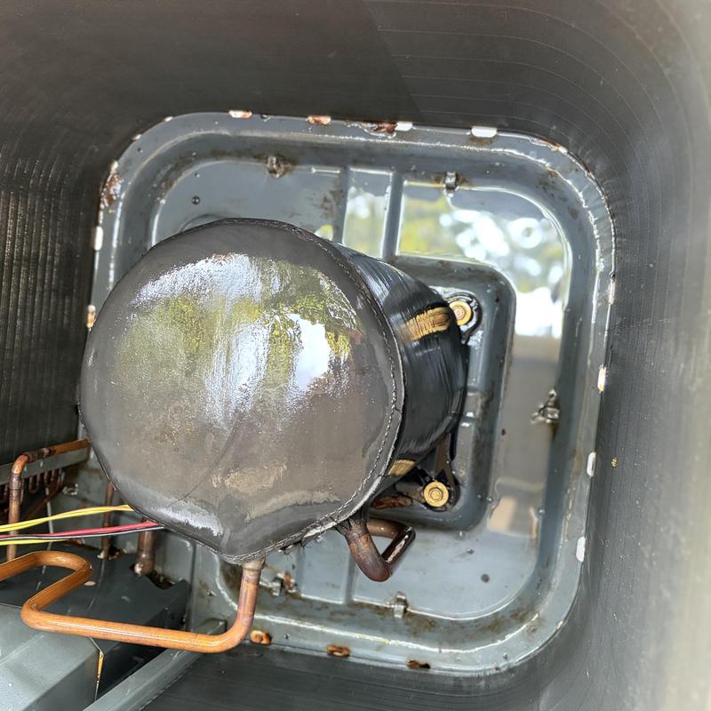 Air conditioner compressor inside condenser unit view Air conditioner compressor inside condenser unit view