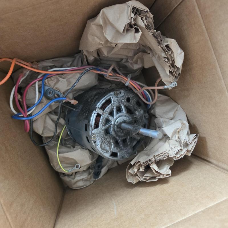 Indoor blower motor with wiring in cardboard box Indoor blower motor with wiring in cardboard box