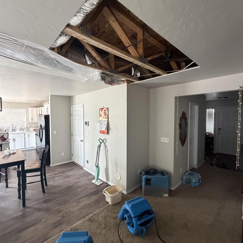 Air conditioner ductwork leak repair with ceiling access panel removed Air conditioner ductwork leak repair with ceiling access panel removed