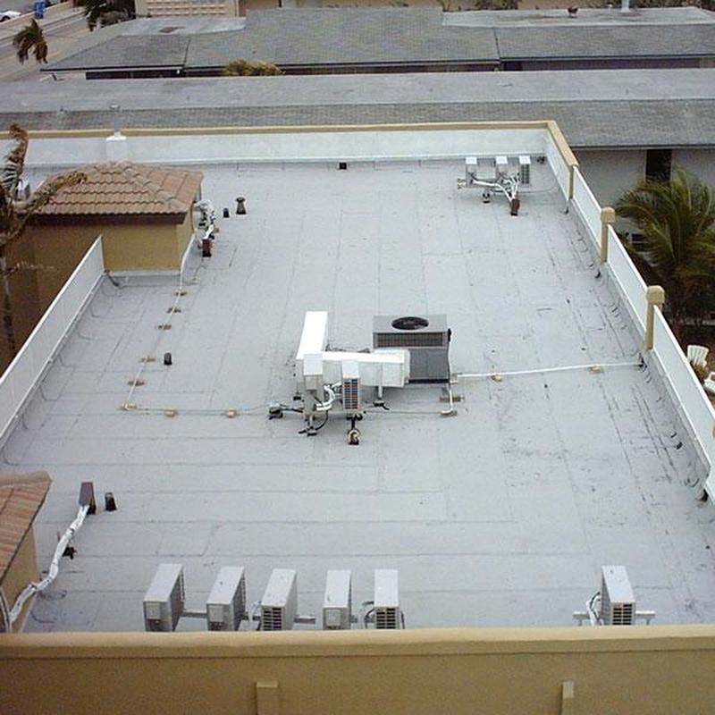 Flat commercial roof with HVAC units and ventilation systems Flat commercial roof with HVAC units and ventilation systems