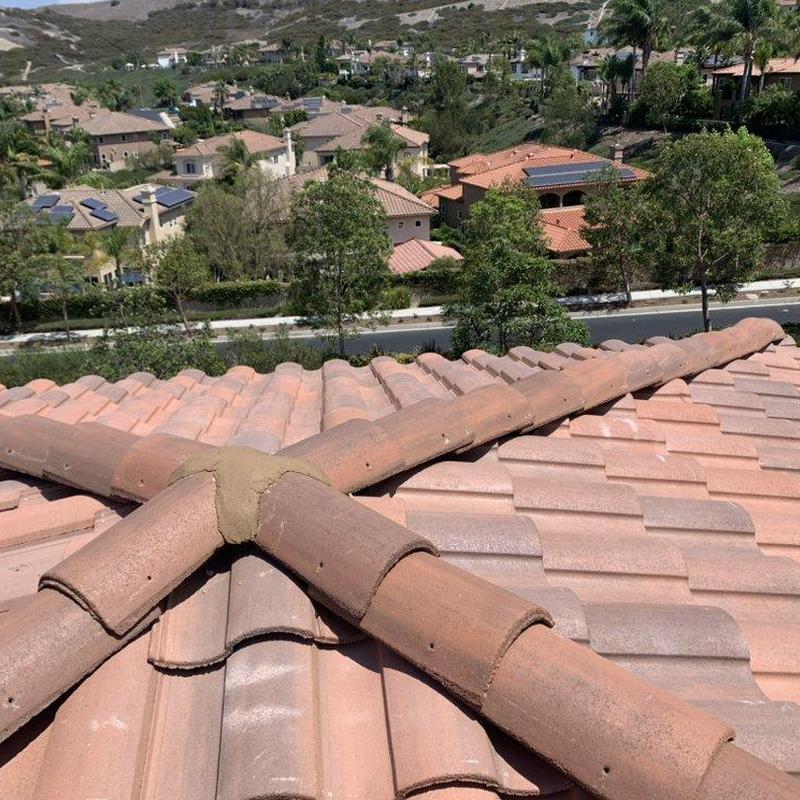 Clay tile ridge cap on residential roof in Irvine California Clay tile ridge cap on residential roof in Irvine California