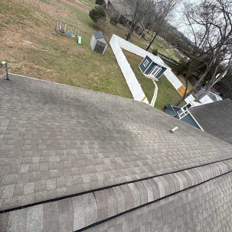 Asphalt shingle roof with visible wear and vent pipe