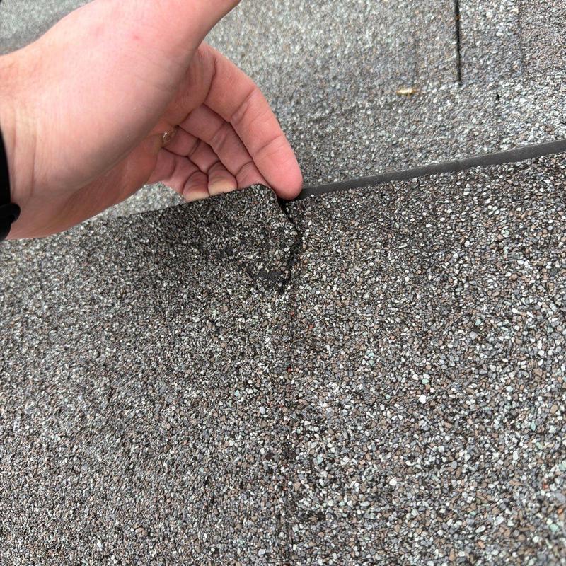 Asphalt roof shingles with hail damage inspection