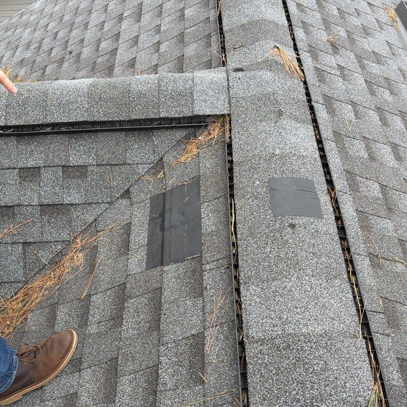 Asphalt shingles with hail damage and patch repairs
