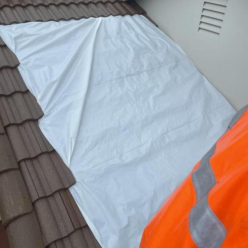 Clay tile roof under protective tarp in Copperopolis Clay tile roof under protective tarp in Copperopolis