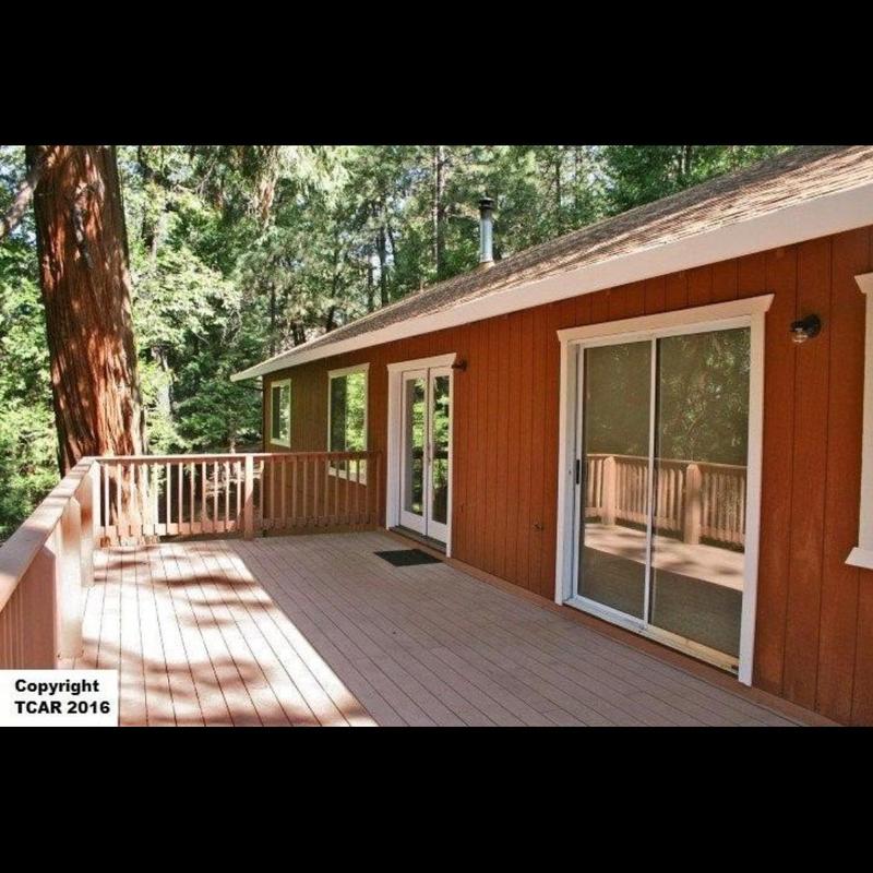 Wood deck with railing and glass sliding door Wood deck with railing and glass sliding door