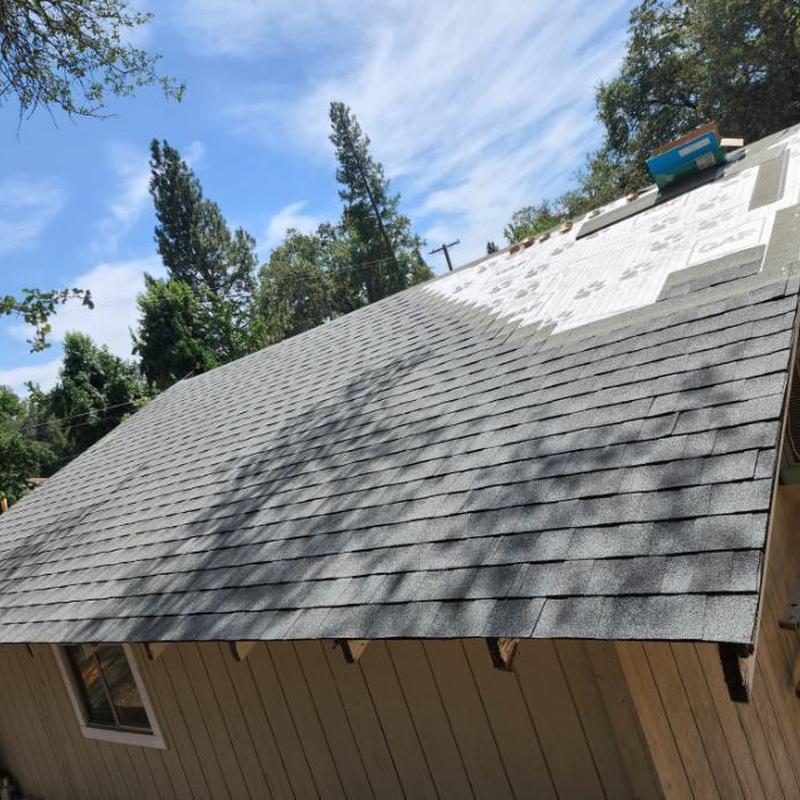 GAF 50 year asphalt roofing installation on home roof GAF 50 year asphalt roofing installation on home roof