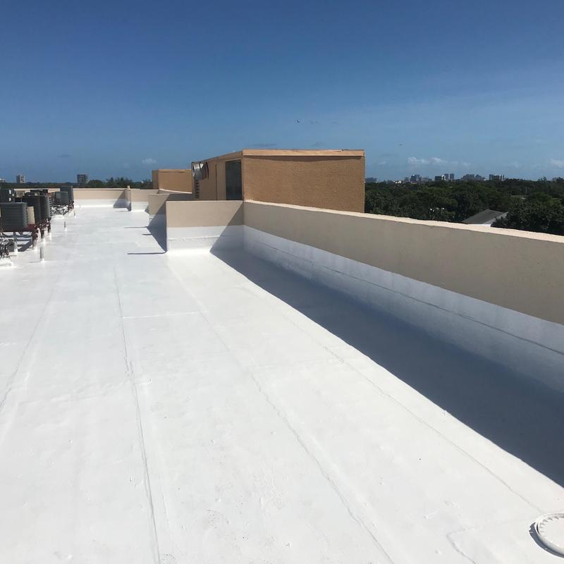 Commercial flat roof with white membrane coating Commercial flat roof with white membrane coating