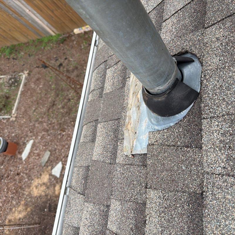 Roof vent pipe flashing with hail damage on shingles